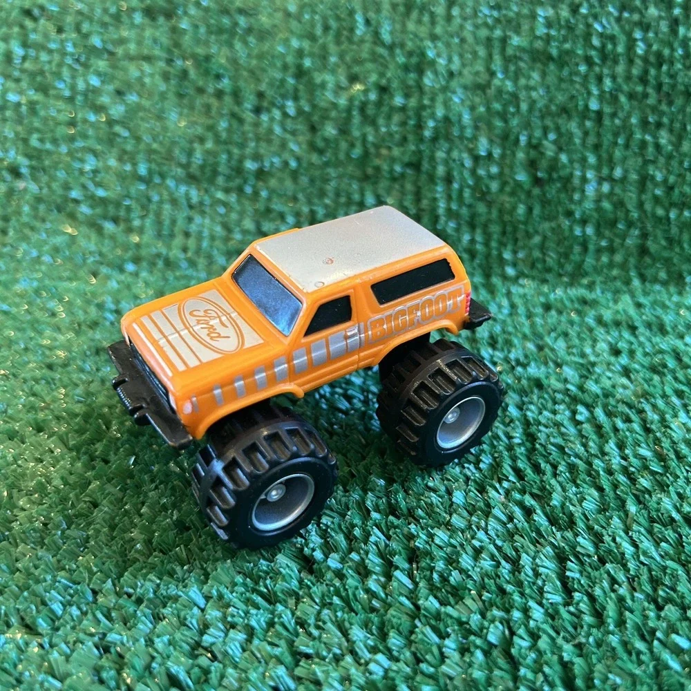 McDonalds Happy Meal Toys‎ 1987 Ford Bigfoot Trucks, orange truck